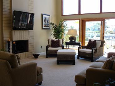  Breezy livingroom with channel view and access to back deck and private boat dock.