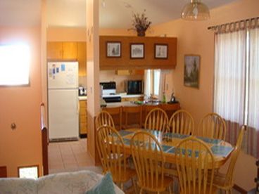 Dining area and fully stocked kitchen.
