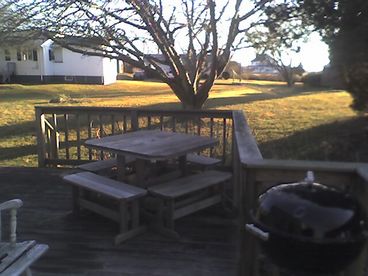Deck with grills and picnic table.  Large backyard can accommodate volleyball, badmitton, or croquet