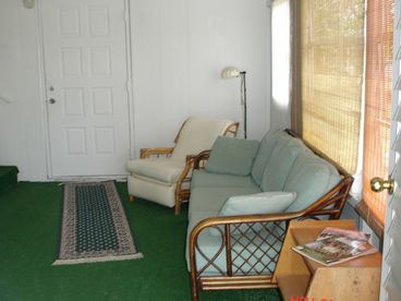 The front door is behind from the carport. The door you see in this photo leads to laundry.