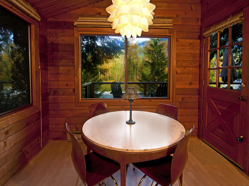 Relax around the dining table while taking in amazing river views.