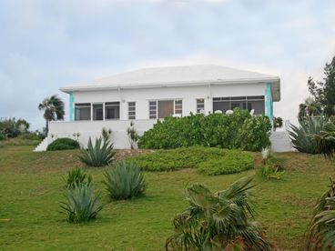 From the rear of the house, it is a gentle slope to the beach
