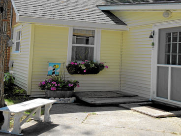 Cheerful flower boxes and  perennial flower beds.