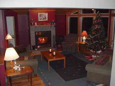 View from the diningroom into the livingroom on the main level. There\'s another family room on the lower level, not shown.