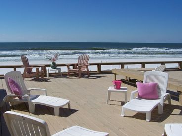 Walk directly out on huge deck . Benches, lounges , gas grill, dining table for 12., umbrellas , beach chairs, toys and games