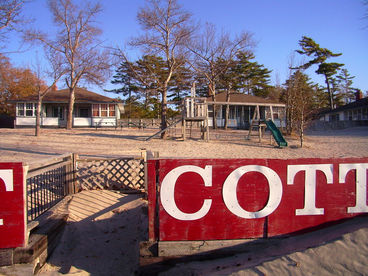 View from the beach of all three of our 4 B/R
cottages and the playground area in our private fenced-in yard 