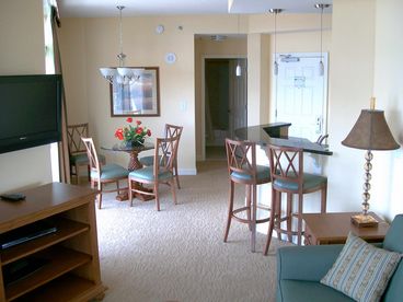 View from living room towards entry door & bar