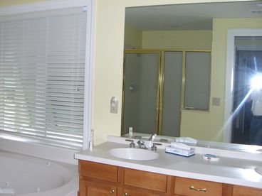one of two master bathrooms