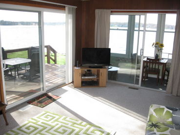 Open living room, kitchen to deck and front screened in porch.