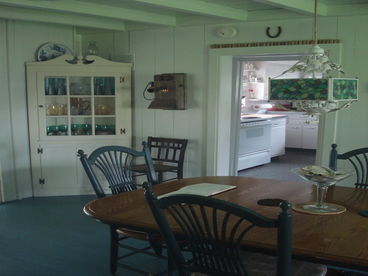 Fully Equipped Dining Room with 4 leafs inside the table, buffet and dishes storage cabinets.