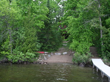 Sand beach on sand bottom lake.