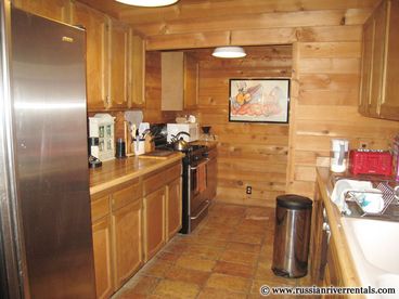 Many hearty meals have been cooked up in this lovely galley kitchen, which has all stainless steel appliances.