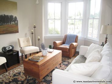 Every room is full of windows and has been lovingly furnished with pieces that combine modern comfort with classic style and beauty. Take in the restful view of town from these bay windows.