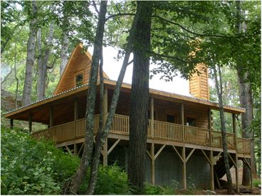 Our cabins feature every luxury, from a big stereo hot tub, featherbeds, and heated towels to highspeed internet, HDTV flatscreen, and central air conditioning.  A rocking chair front porch, huge screened porch, and charcoal grill make outdoor living great too.