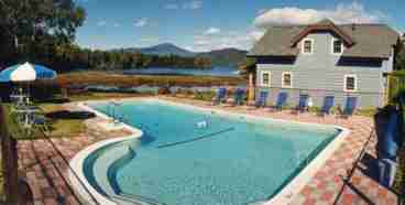 Lounge in our heated outdoor pool with views of Whiteface Mountain and Lake Placid.