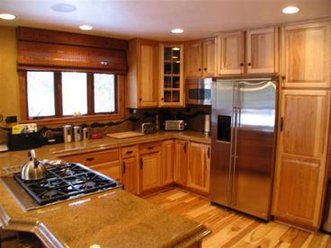Enjoy cooking in the large gourmet kitchen complete with granite countertops, stainless steel appliances.