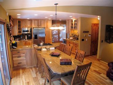 The dining area is adjacent to the kitchen with plenty of seating.