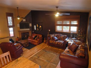 Large living room area offers a great place to enjoy he gas fireplace and 50\