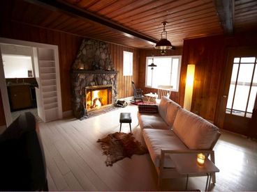 Living room with giant stone fireplace