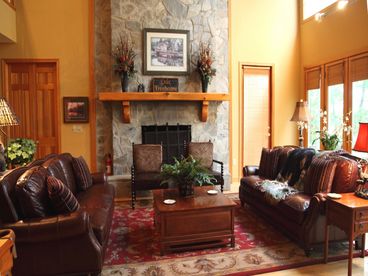 Great Room frames our unsurpassed view with 2 1/2 stories of glass! The Great Room has seating for 10 and a 35+ ft slate wood burning fireplace!