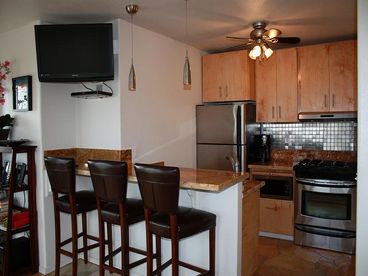Granite Counter/Bar area. Stainless steel appliances and all the utensils you will need to cook!