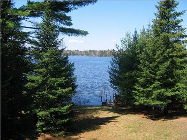 Magnificent view of Chain Lake from the deck. Chain Lake is one of 5 Lake called the Sugar Camp Chain.  You can navigate of 5 lakes with your boat.  Dining on the lakes too!