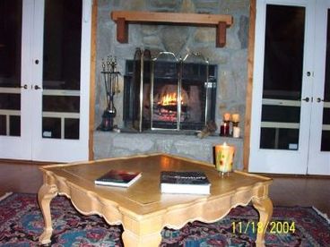  Fireplace with double french doors on both side leading to front porch