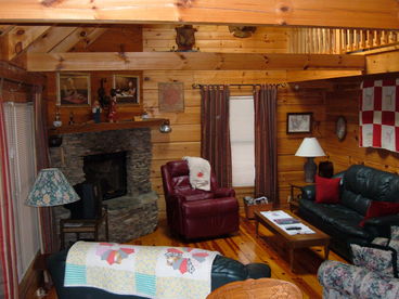 open living room with 20 ft open beam ceilings