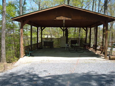 Large pavillion with picnic tables and charcoal grill