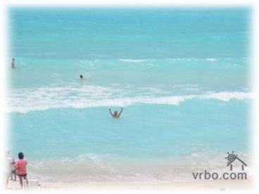 Swim or boogie board in the beautiful, warm, turquoise blue water!