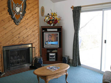 Enjoy the views, watch TV and relax by the fireplace.