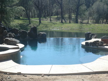 Overlooking the lower pond, you can relax by our infinity edge pool. 