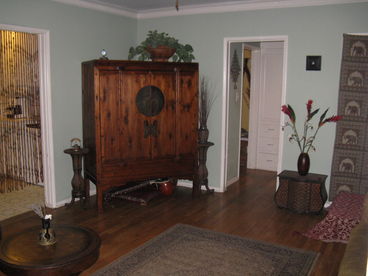 living room, Chinese cabinet.  The TV is hidden inside the Chinese cabinet, keeping the decor serene and uncluttered