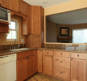 A spacious and open kitchen with new cabinets and fixtures is plenty of room to chat with family and friends while preparing tasty snacks.