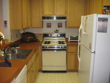 Kitchen has Dishwasher, full size stove, frig and microwave
