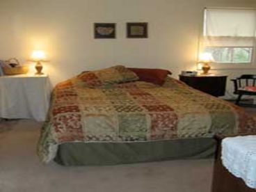 Master bedroom with queen bed, private bathroom with walk-in shower.