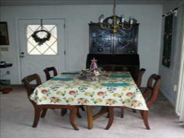 Dining area with table and 4 chairs, also eat-at counter in adjacent kitchen, can add card-table and chairs if needed. Or dine outside on the deck.