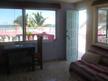 Lounge in the middle apartment with view of Gulf and roof terrace.