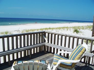 Porch with built-in benches, lounge chairs for enjoying the sun.