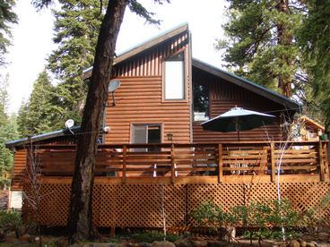 Back yard that boasts a 20\' deck, hot tub for six and fenced-in, landscaped yard.
