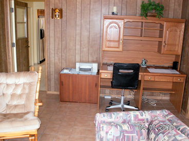 View from inside the Arizona Room looking at the Computer desk and door to Laundry Room