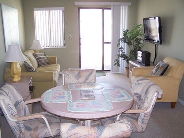 Remodeled dining area and living room with 37-inch HD flat screen cable TV
