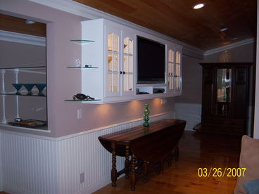 Entertainment center with DVD, Cable TV and wireless Internet. Large dining room table and buffet