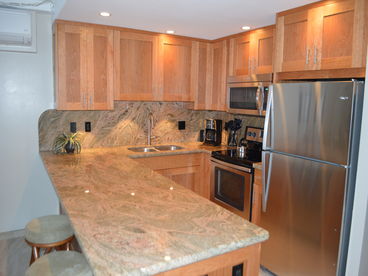 Newly remodeled kitchen.  New cabinets, granite, stainless steel appliances and tile floor