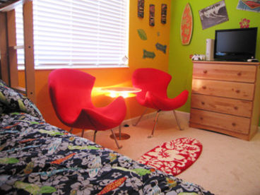 This room has a full over full bunk bed, an LCD TV, an Xbox360 Game Console with games, and cable.  There is also built in DVD capability and an alarm clock.