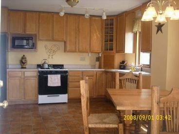Large Kitchen with full amenites and Breakfast table seating for 4