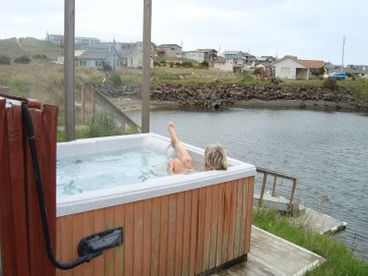 Large hot tub with fabulous views of the private lagoon and dock, Waldport Bridge and the Alsea Bay!