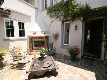 Courtyard with fireplace and seating