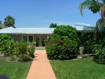 Lush foliage surrounds home sitting
on 2 acres.  Very Private.