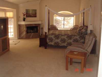 Master bedroom has cherry wood four poster bed, marble fireplace 27